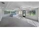 Spacious sun room features recessed lighting, fan, tile entryway, and large windows overlooking the yard at 5624 Laurel Oak Dr, Lakeland, FL 33811