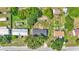 This is an aerial view of the home, its surrounding lawns, and neighboring homes at 5751 Cherry Tree Dr, Lakeland, FL 33811