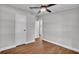 Bright bedroom with ceiling fan and wood-look flooring at 5751 Cherry Tree Dr, Lakeland, FL 33811