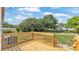 A wood deck sits in the back yard of this home, offering a perfect spot to relax and enjoy the outdoors at 5751 Cherry Tree Dr, Lakeland, FL 33811