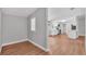 Open-concept room showcasing flooring and access to kitchen and other living space at 5751 Cherry Tree Dr, Lakeland, FL 33811