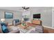 Comfortable living room with modern decor, stylish furniture, and a view of the dining area at 5751 Cherry Tree Dr, Lakeland, FL 33811