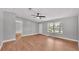 Inviting living room with wood-look vinyl floors, ceiling fan and natural light at 5751 Cherry Tree Dr, Lakeland, FL 33811