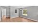 Neutral living area with modern light fixture and natural light from the window at 5751 Cherry Tree Dr, Lakeland, FL 33811