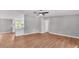 Open-concept living room with durable wood floors flowing into the updated kitchen, creating a seamless living space at 5751 Cherry Tree Dr, Lakeland, FL 33811