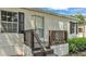 Close-up of the home's front porch, showcasing the wooden steps, railing, and charming details around the entrance at 5751 Cherry Tree Dr, Lakeland, FL 33811