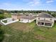 Aerial view of the house, showcasing the large backyard and patio at 5793 Dornich Dr, Auburndale, FL 33823