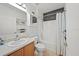 Bright bathroom with a shower-tub combo and a vanity with a sink at 5793 Dornich Dr, Auburndale, FL 33823