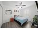 Cozy bedroom with a ceiling fan, wooden flooring, and lots of natural light at 5793 Dornich Dr, Auburndale, FL 33823