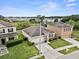Beautiful home with a well-manicured lawn, stone accents, and an attached two-car garage at 5793 Dornich Dr, Auburndale, FL 33823