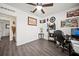 Home office with hardwood floors, a ceiling fan, and a desk with a computer at 5793 Dornich Dr, Auburndale, FL 33823