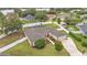 An aerial view highlights the property's expansive layout and the screened pool area at 601 Pintail Cir, Auburndale, FL 33823
