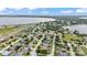 Expansive aerial view showcasing a residential community nestled near a serene lake at 601 Pintail Cir, Auburndale, FL 33823