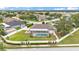 A neighborhood view showcases the property's lush landscaping and screened pool at 601 Pintail Cir, Auburndale, FL 33823