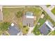 Overhead captures a beautifully landscaped property with a screened-in pool at 601 Pintail Cir, Auburndale, FL 33823