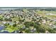 Beautiful neighborhood aerial view, showcasing tree-lined streets and waterfront properties at 601 Pintail Cir, Auburndale, FL 33823