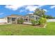 Lush backyard with a screened pool area, providing a private and relaxing outdoor space at 601 Pintail Cir, Auburndale, FL 33823