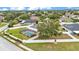 Inviting backyard oasis featuring a screened pool, lush greenery, and a secure white fence at 601 Pintail Cir, Auburndale, FL 33823