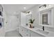 Bathroom featuring double sinks and walk-in shower at 601 Pintail Cir, Auburndale, FL 33823