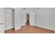 A well-lit bedroom boasts wood-look floors and a large closet for storage at 601 Pintail Cir, Auburndale, FL 33823