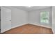 Comfortable bedroom features hard surface floors, a window, and a closet behind the door at 601 Pintail Cir, Auburndale, FL 33823