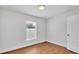 A cozy bedroom featuring wood-look floors and bright natural light at 601 Pintail Cir, Auburndale, FL 33823