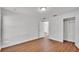 Neutral bedroom featuring hard surface floors, a closet, and a light fixture at 601 Pintail Cir, Auburndale, FL 33823