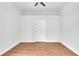 A bright bedroom featuring hardwood floors and a ceiling fan at 601 Pintail Cir, Auburndale, FL 33823