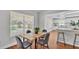 Dining area with a view of the pool and open to kitchen at 601 Pintail Cir, Auburndale, FL 33823