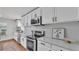Bright kitchen featuring stainless appliances and light countertops and backsplash at 601 Pintail Cir, Auburndale, FL 33823