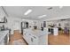 Large kitchen with island, wine cooler, and breakfast table at 601 Pintail Cir, Auburndale, FL 33823