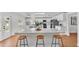 Eat-in kitchen with white cabinets, modern appliances and light countertops at 601 Pintail Cir, Auburndale, FL 33823
