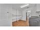 Laundry room with lots of shelving next to kitchen at 601 Pintail Cir, Auburndale, FL 33823