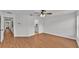 Expansive living room featuring hard surface floors, a ceiling fan and views to other rooms at 601 Pintail Cir, Auburndale, FL 33823
