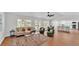 Bright and airy living room flows seamlessly to the outdoor area with pool views and comfortable seating at 601 Pintail Cir, Auburndale, FL 33823