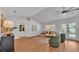 Bright and airy living room flows seamlessly to the outdoor area with pool views and comfortable seating at 601 Pintail Cir, Auburndale, FL 33823