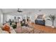 Open concept living room features wood floors, vaulted ceiling, and a stylish decor at 601 Pintail Cir, Auburndale, FL 33823
