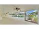 Large screened-in patio with ceiling fans overlooking pool at 601 Pintail Cir, Auburndale, FL 33823