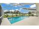 Blue swimming pool enclosed in a screen, offering a cool retreat on a hot day at 601 Pintail Cir, Auburndale, FL 33823