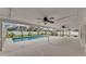 Enclosed pool with ceiling fans and ample space for lounging and entertaining at 601 Pintail Cir, Auburndale, FL 33823