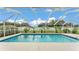 Relaxing screened-in pool area offers a private oasis with a sparkling pool and verdant landscaping at 601 Pintail Cir, Auburndale, FL 33823