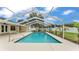 Screened in pool with blue water and covered enclosure, great for outdoor enjoyment at 601 Pintail Cir, Auburndale, FL 33823