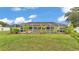An inviting screened pool area with lush landscaping offers a private oasis at 601 Pintail Cir, Auburndale, FL 33823