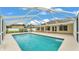Outdoor screened in swimming pool with adjacent patio area, perfect for leisure and recreation at 601 Pintail Cir, Auburndale, FL 33823