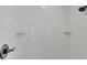 New tiled shower featuring built-in soap shelves and showerhead at 601 Pintail Cir, Auburndale, FL 33823