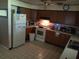 Functional kitchen equipped with standard appliances and ample wood cabinetry at 629 W Williams St, Lakeland, FL 33805