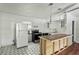 Kitchen features updated floors and an island at 633 Glenda St, Lakeland, FL 33805