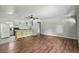 Living space flows into kitchen, showcasing flooring and breakfast bar at 633 Glenda St, Lakeland, FL 33805