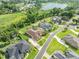 Aerial view showcasing a neighborhood, featuring a home with a private pool at 6357 Ashley Dr, Lakeland, FL 33813