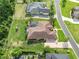 Aerial view of a single-Gathering home with a screened-in pool and lush landscaping at 6357 Ashley Dr, Lakeland, FL 33813
